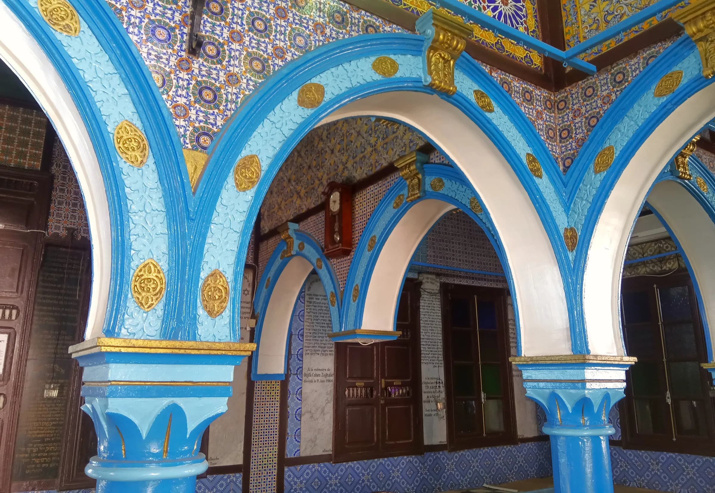 Blue and white painted arches at the El Ghriba Synagogue in Djerba