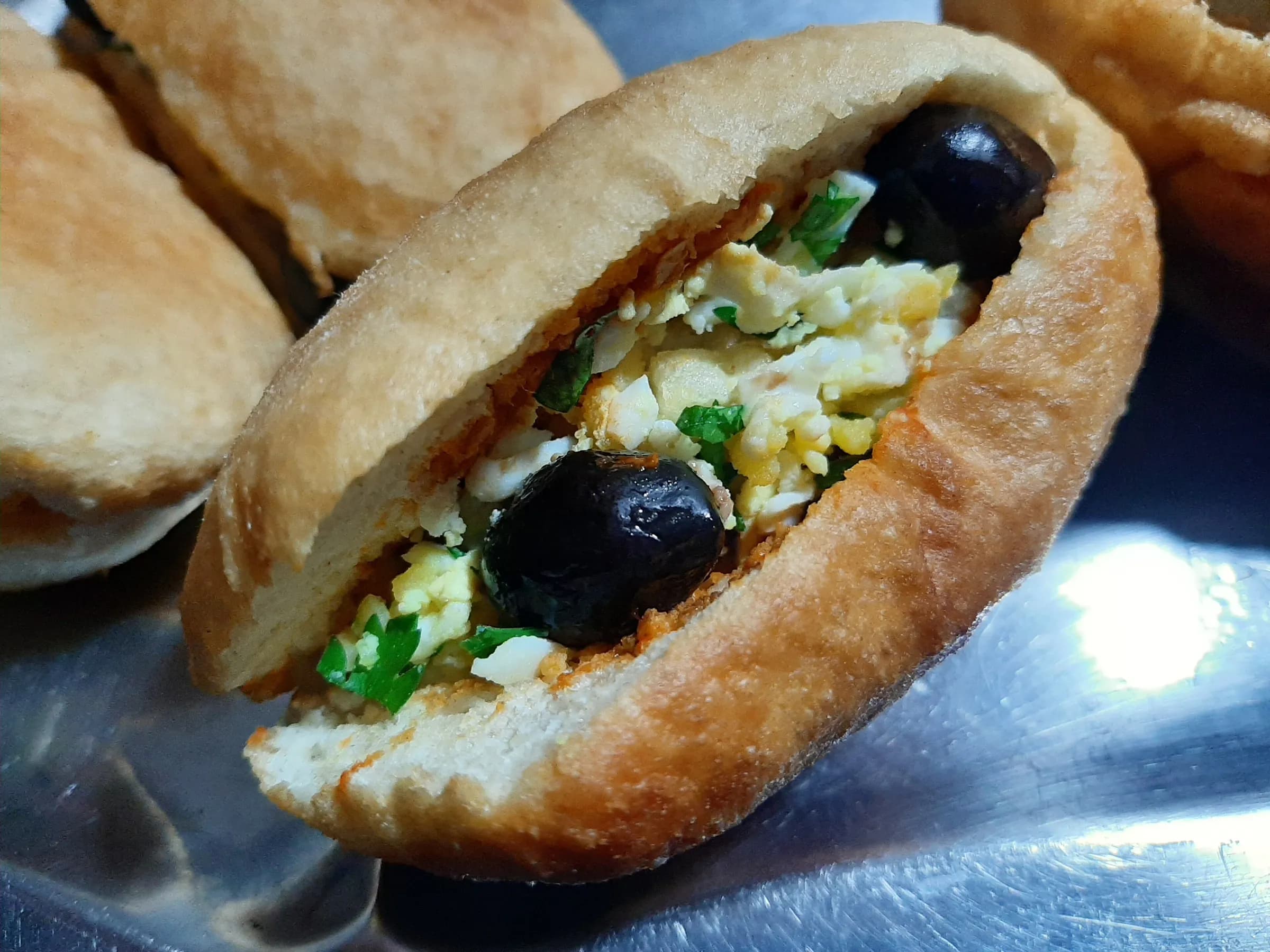 A fricassé, the small fried Tunisian sandwich, filled with tuna, egg and olives